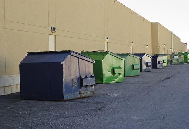 metallic dumpster units staged for construction garbage in Medina, WA